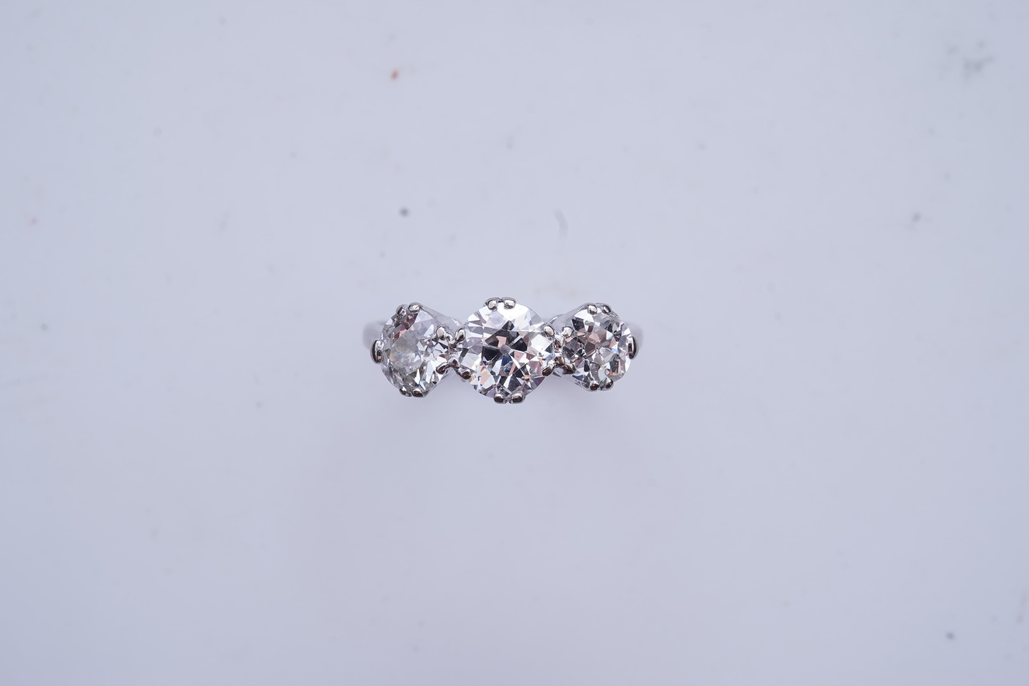 A three-stone diamond ring, early 20th century